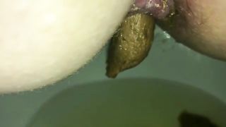 Hairy milf pushing big turd