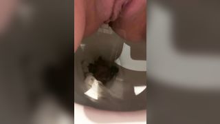 Close up of shaved teen shitting