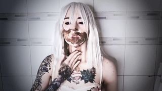 Smearing poop on her sexy face