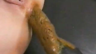 Licking poop from buttplug