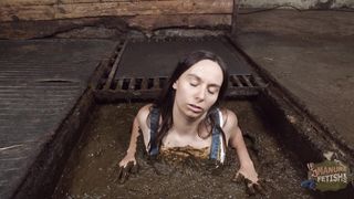 Girl bathing and masturbating in cow dung