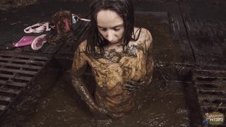 Girl bathing in cowshit