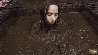 Girl bathing in cowshit