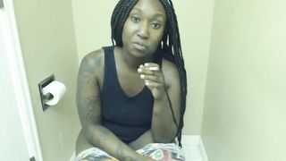 Black girl smoking while pooping