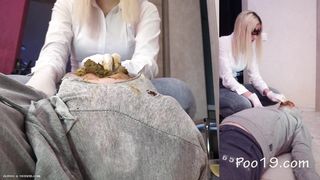 Masked blonde babe feeds slave