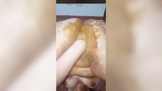 Nasty milf shits on own face