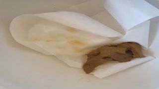 Brown shit over toilet