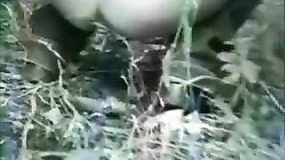 Two girls poop together in nature