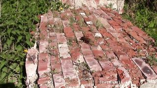 Busty babe shitting outdoor