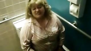 Chubby blonde shits over toilet