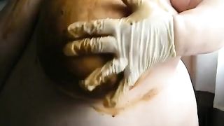 Smearing poop on big tits