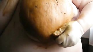 Smearing poop on big tits