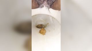 Hairy ebony shits in toilet