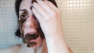 Smearing shit on face and tits