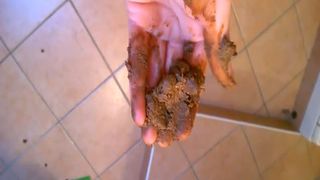 Smearing shit on her pretty face