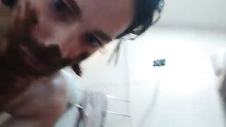 Rubbing shit on entire face