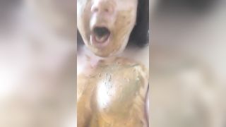 Rubbing brown shit on entire body slowly