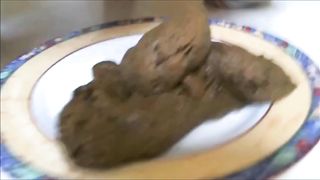 Girl shitting a big load on a plate