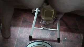 Mature lady shit a big load of diarrhea and piss on glass