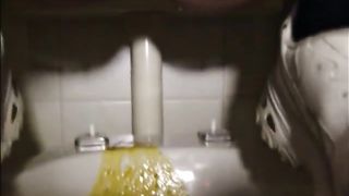 Constipate girl shitting a big load of liquid shit on the wc