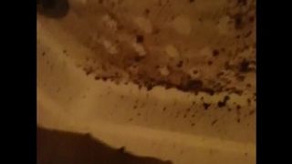 Woman shitting a very liquid diarrhea in the shower