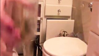 Blonde girl shitting in a glass
