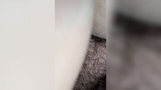 Hairy amateur lady pooping in closeup