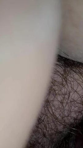 Hairy amateur lady pooping in closeup