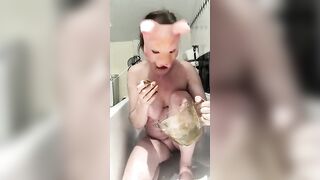 Pig masked busty swallows her own shit
