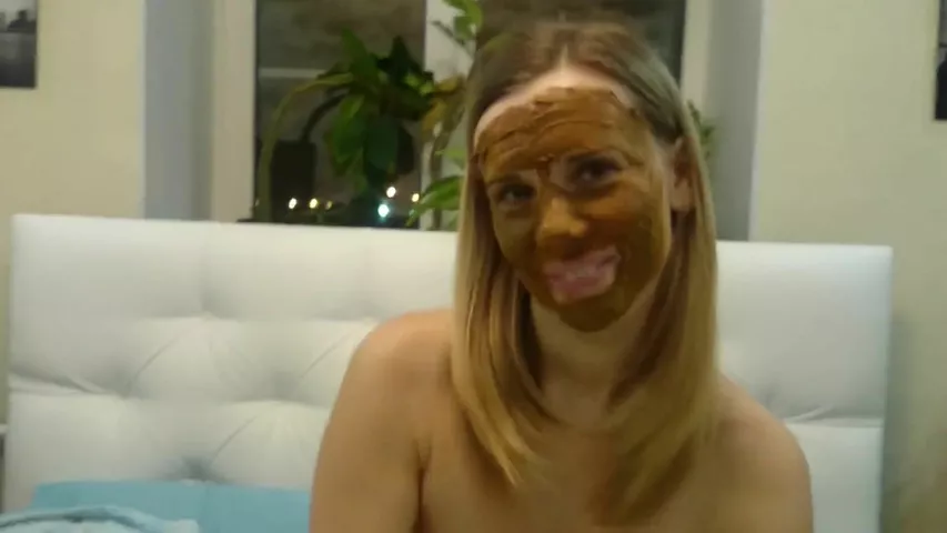 Young blonde smears poop on her lovely face
