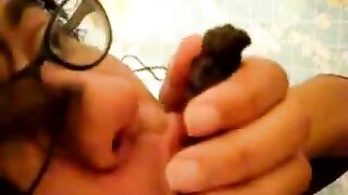 Chick in glasses licking and eating big turd