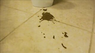 Lady in high heels fills bucket with diarrhea