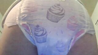 Baby in diaper pooping for you