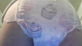 Baby in diaper pooping for you