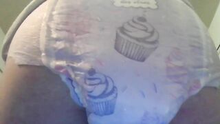 Baby in diaper pooping for you