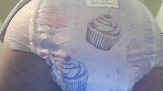 Baby in diaper pooping for you