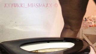 Dirty black ebony ass pooping in the toilet