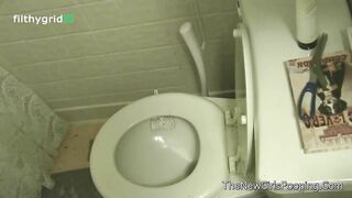 Amateur brunette lady pooping in the toilet