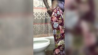 Hot African wife pooping in the toilet