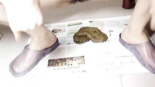 Hot Korean chick with hairy pussy pooping on the newspaper