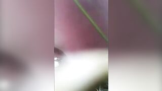 Closeup of sexy lady pooping in the forest
