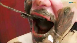 Busty ebony feeding her white lesbian friend with her poop