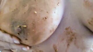 Smearing shit on her big tits