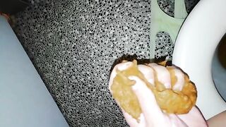 Catching a big turd in her hands