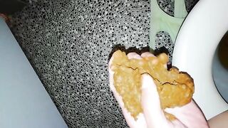 Catching a big turd in her hands