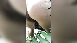 Country babe pooping in the backyard garden