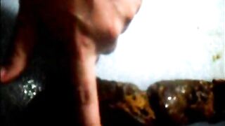 Fingering her messy load after pooping
