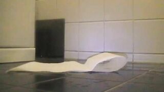 Slutty babe pooping in the tiled floor