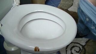 Sexy lady spread ass cheeks in the toilet