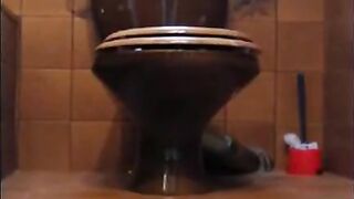 Brunette shitting on her hand